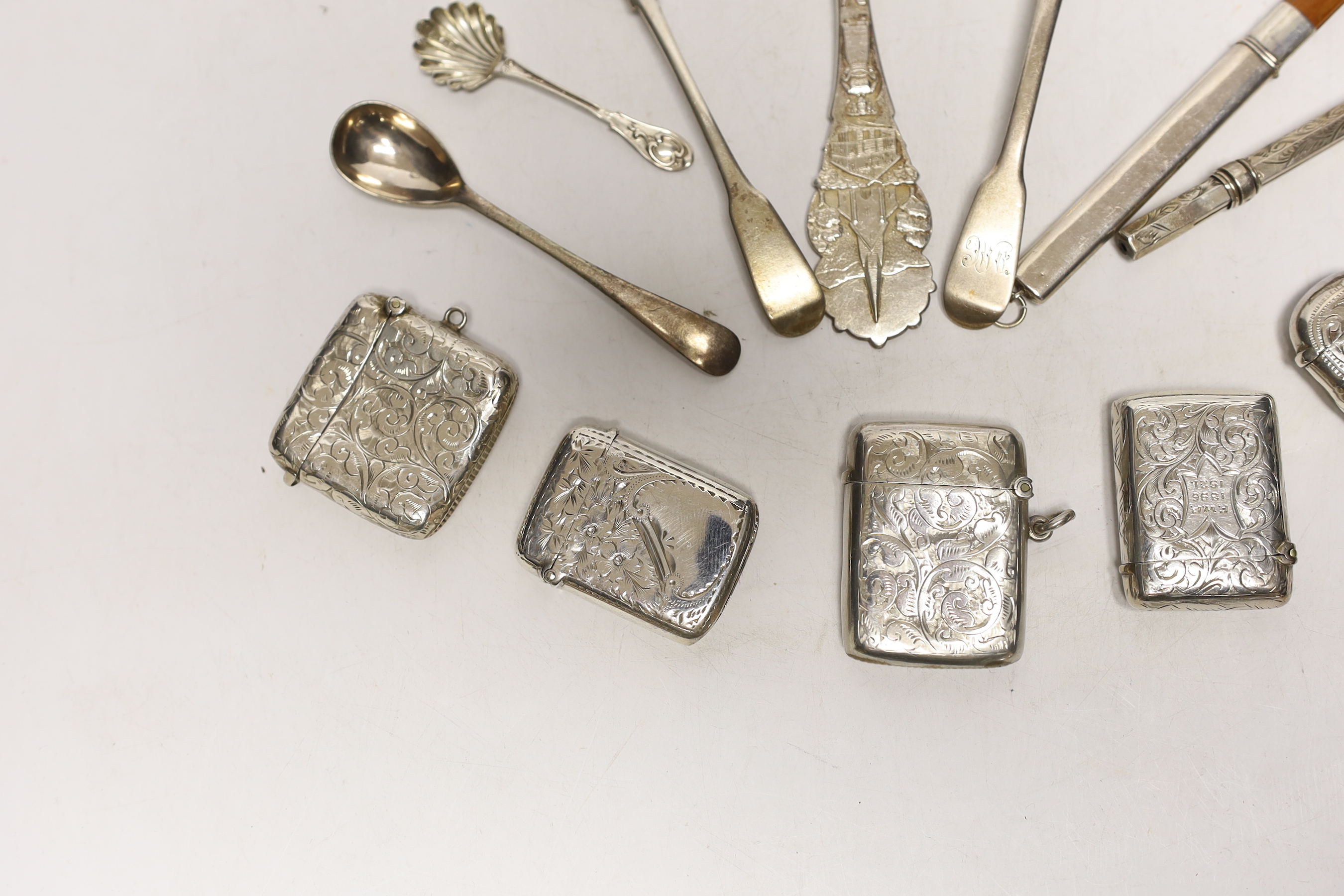 Six assorted early 20th century silver vesta cases, largest 45mm and a small quantity of sundry items including silver condiment spoons and two pencils.